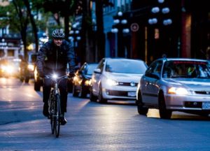 man riding bicycle at night